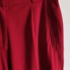 Détail de la taille et de la poche du pantalon vintage rouge Agnès Flo.