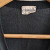 Cardigan vintage noir Donatella femme taille 38, maille fine à motifs losanges ajourés et fermeture boutonnée.